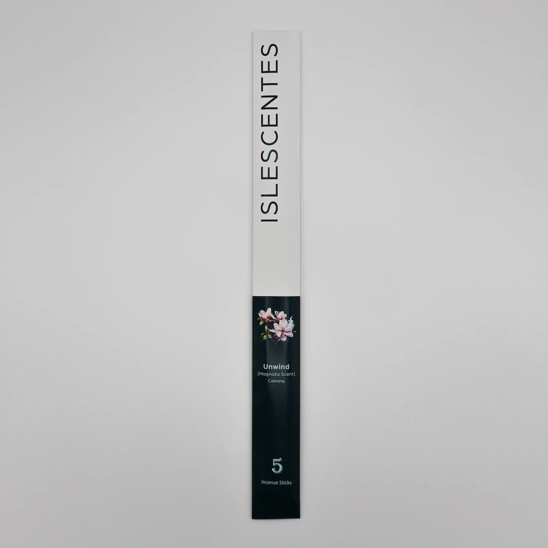 ISLESCENTES Unwind Magnolia Incense Stick product packaging on a gray background