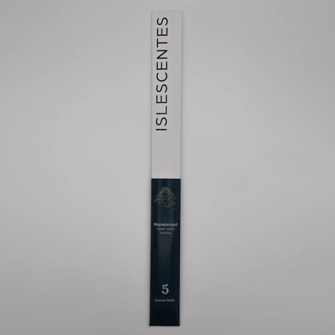 ISLESCENTES Wanderlust Cedar Incense Stick product packaging on a gray background