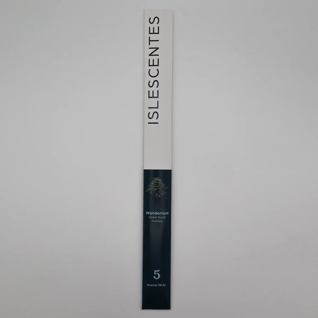 ISLESCENTES Wanderlust Cedar Incense Stick product packaging on a gray background